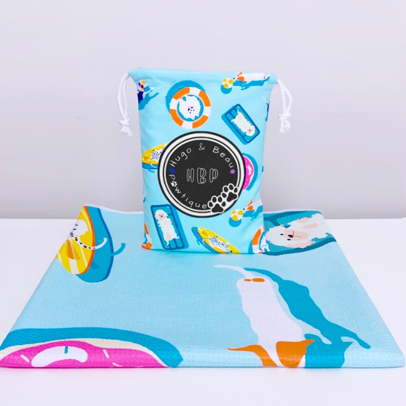 "Microfiber Waffle Towel - Quick Drying & Super Absorbent! Larger than average size: 160x80cm. Can be rolled up compact for saving space. Perfect for mucky pups or pups who love to swim. Comes with a matching drawstring bag (Approx. Size 27x18cm). Unique HBP design with a hook for quick drying. Machine Washable at 30 degrees. Pattern of dogs floating on pool inflatables with logo trademark in the pool inflatables."