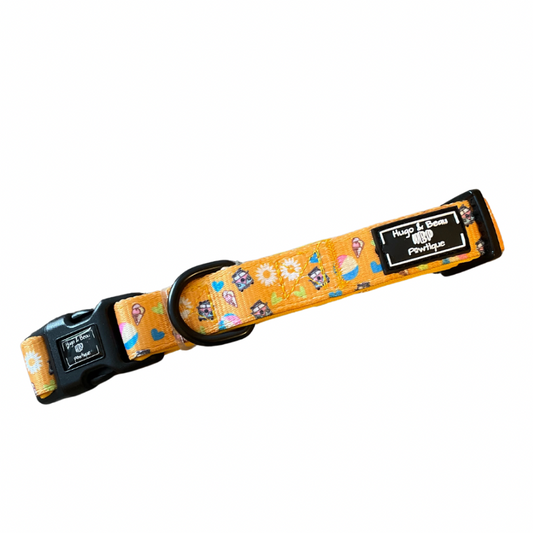 "Yellow dog collar with sunbeams, daisies, ice cream cones, and camper vans, featuring a neck safety clip and the Hbpawtique logo