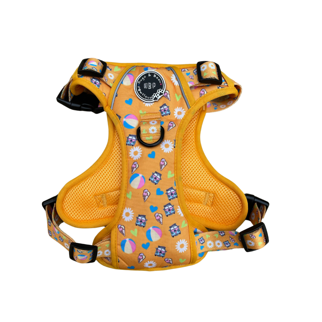 Sunbeams & Ice-cream Dog Harness: A unique HBP design featuring a no-pull, fully adjustable harness!  • Perfect for Summer with our Sunbeams & Ice-creams design • Printed Oxford Fabric with breathable backing mesh for quick drying • Fully adjustable for a comfortable fit • 3 buckle design with neck safety clip for added security • Front and back D rings for attaching leads or ID tags • Easy-grip handle on the back, ideal for hiking with your pup • 